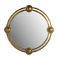 Round mirror with gold decorative frame on a white background