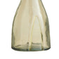 Clear glass bottle with a white candle inside on a white background