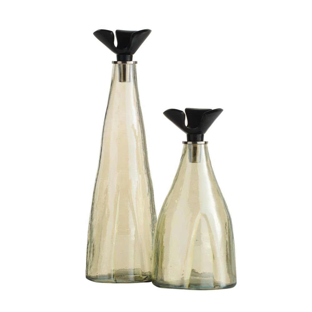 Two glass bottles with black lids on a white background
