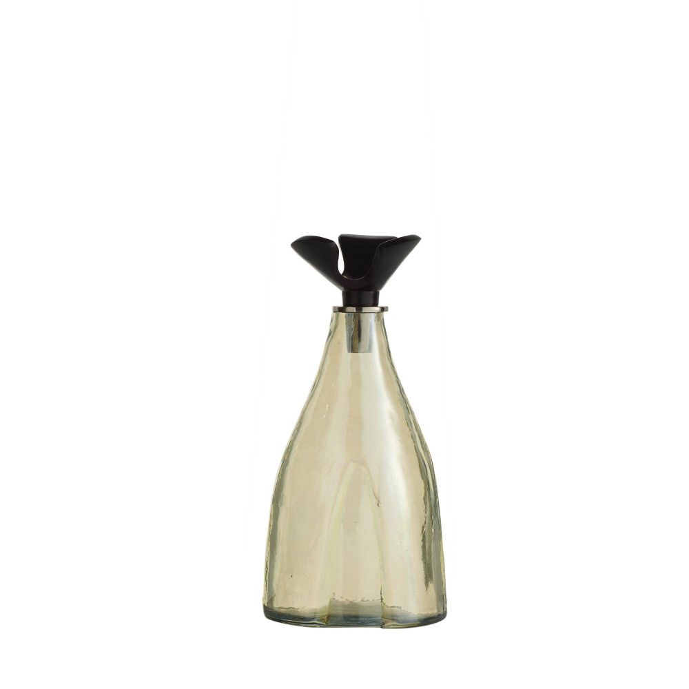 Clear glass bottle with black cap on a white background