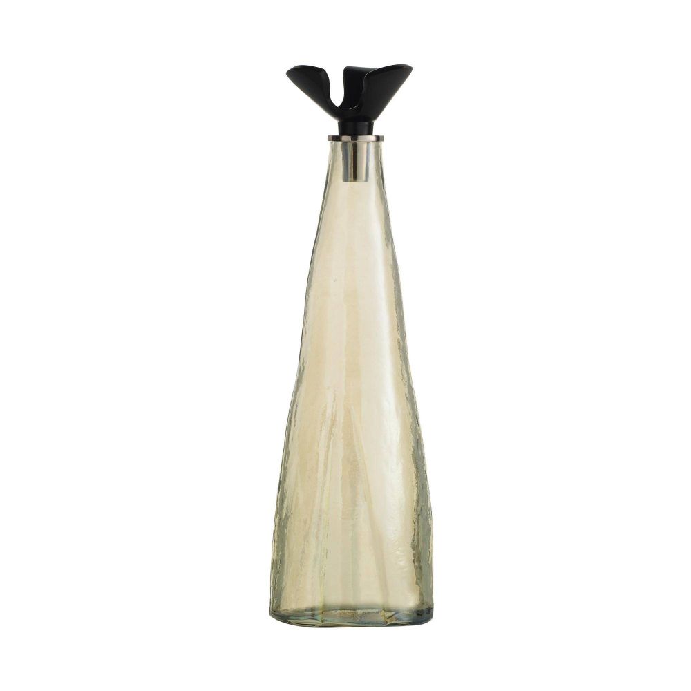 Tall, transparent glass bottle with a black cap on a white background