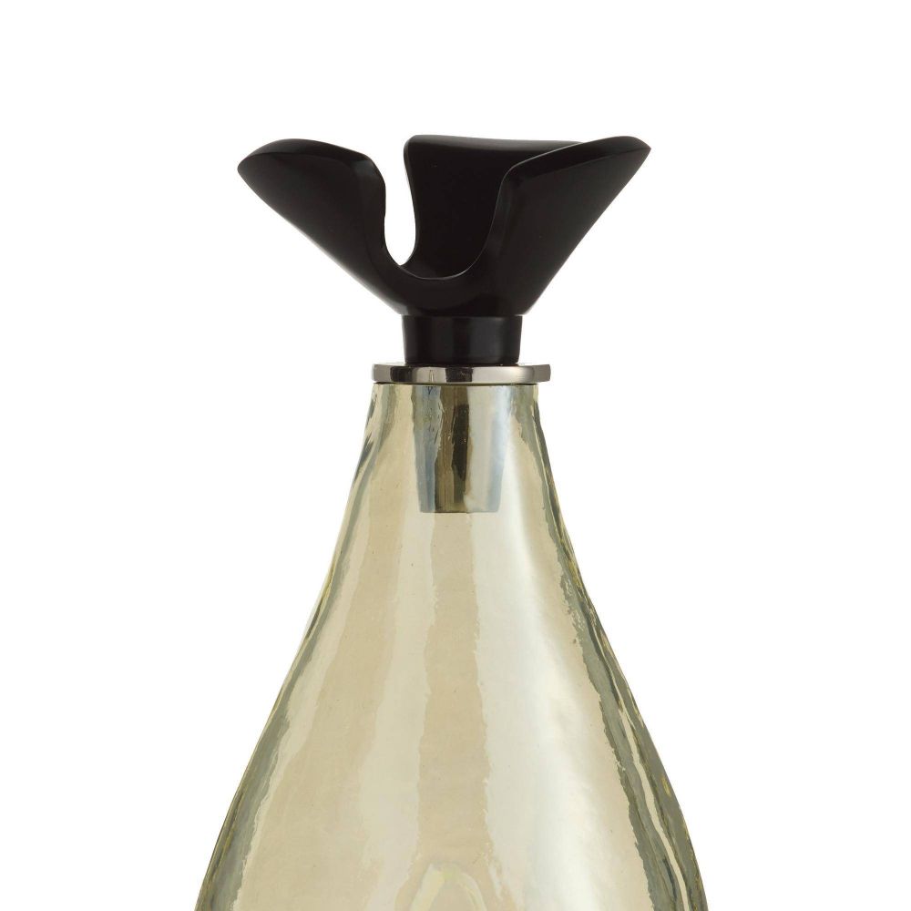 Clear glass bottle with a black cap on a white background