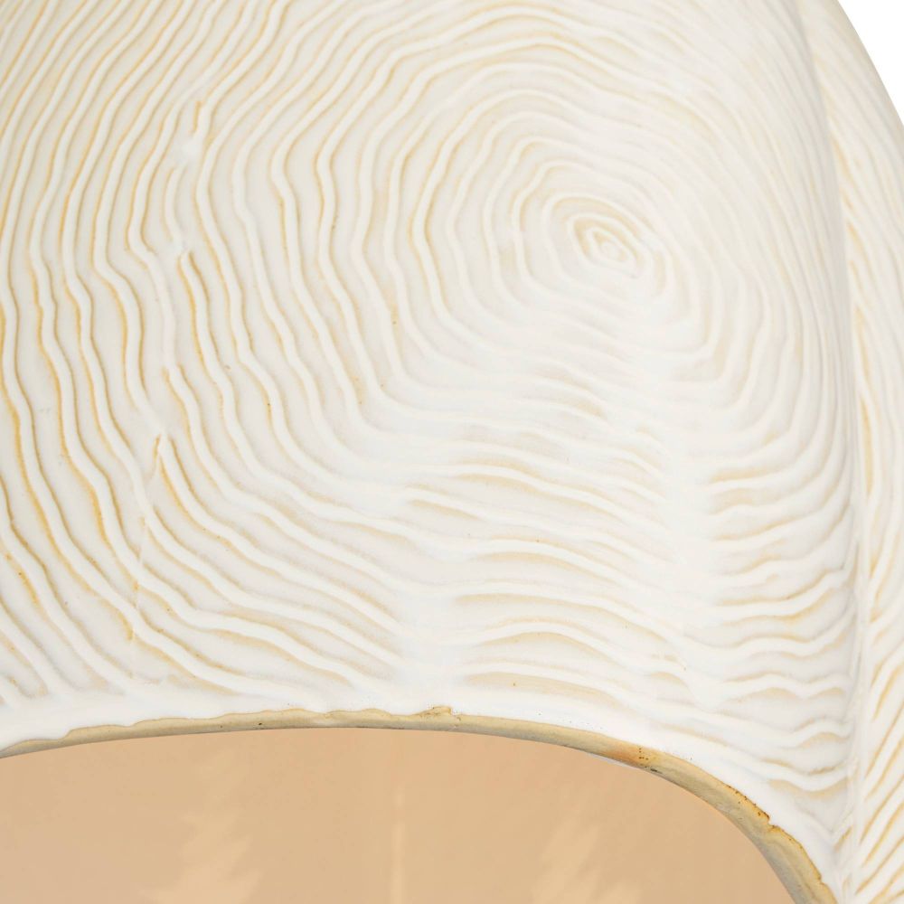 Close-up of a textured white surface with concentric circular patterns