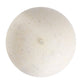 Round beige stone with a small hole on a white background