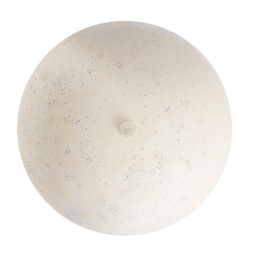 Round beige stone with a small hole on a white background