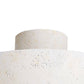 Close-up of a textured white ceramic vase on a white background