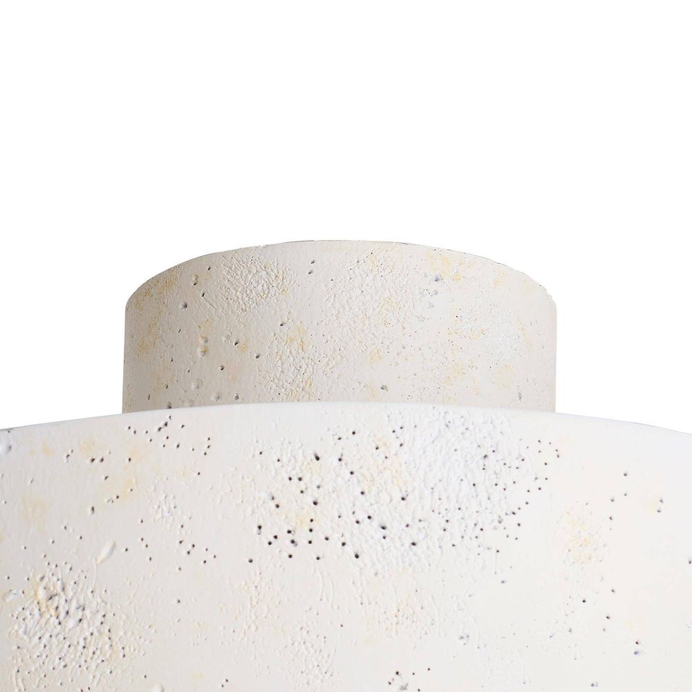 Close-up of a textured white ceramic vase on a white background