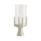White candle holder with a cylindrical glass candle on a white background