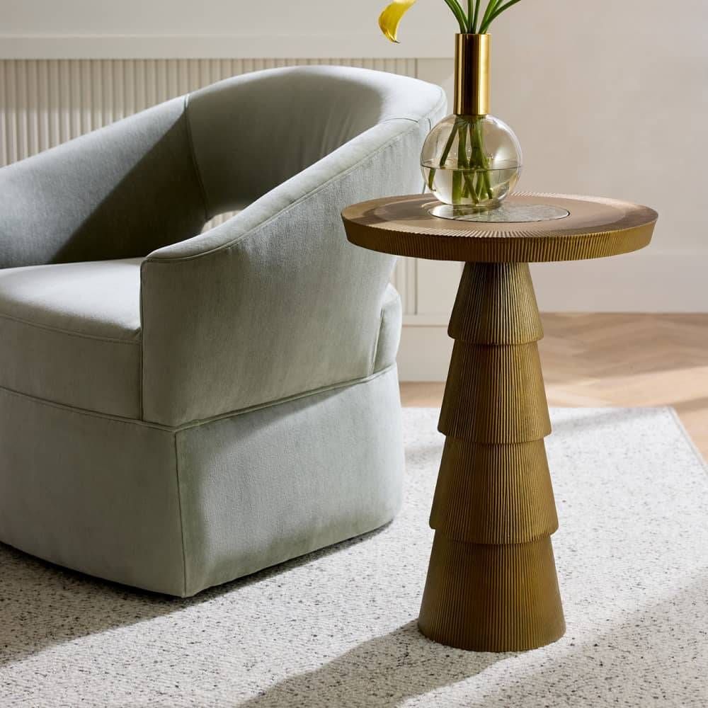Modern living room with a gray sofa and a wooden side table.
