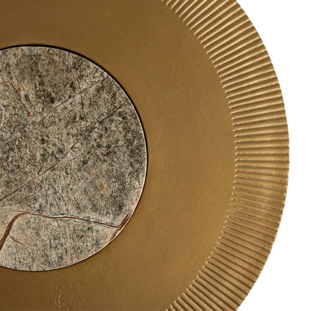 Close-up of a gold circular object with textured surface