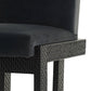 Black dining chair with cushioned seat and backrest on a white background