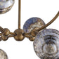 Close-up of a chandelier with metallic and glass elements on a white background