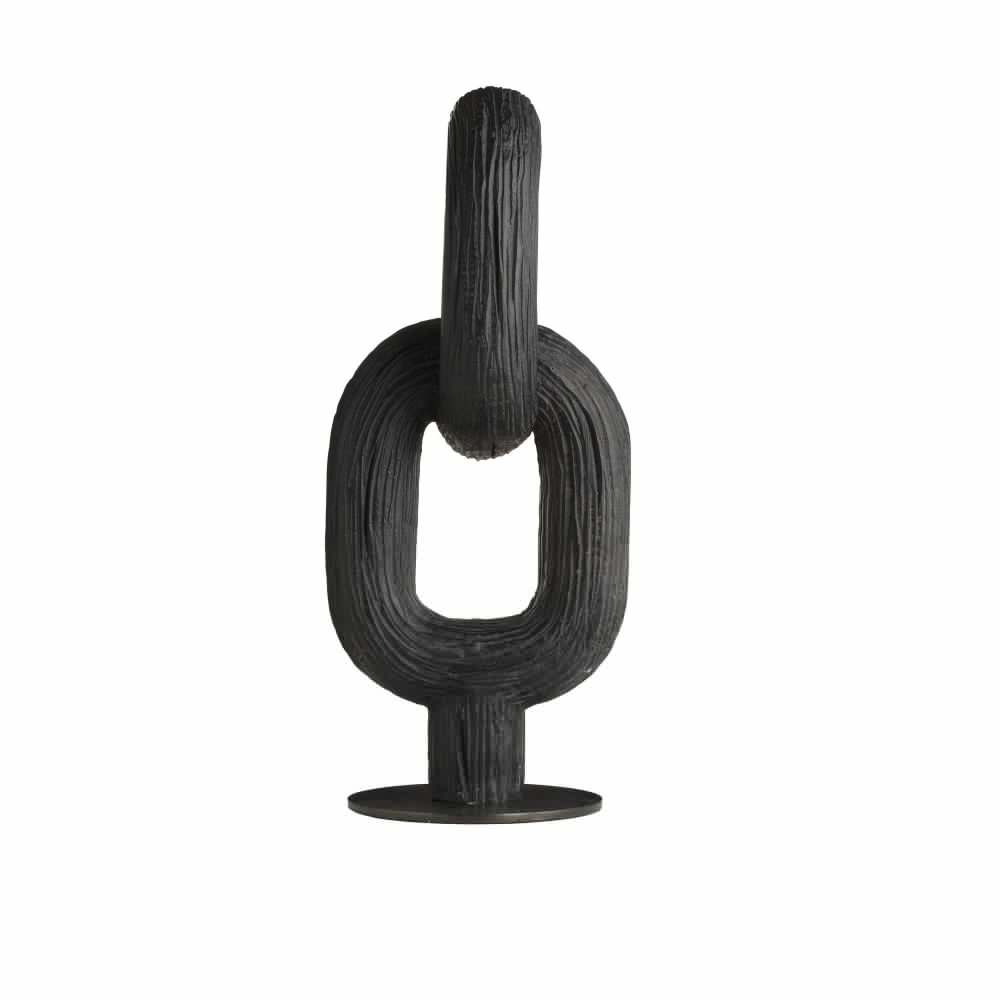 Black abstract sculpture on a white background