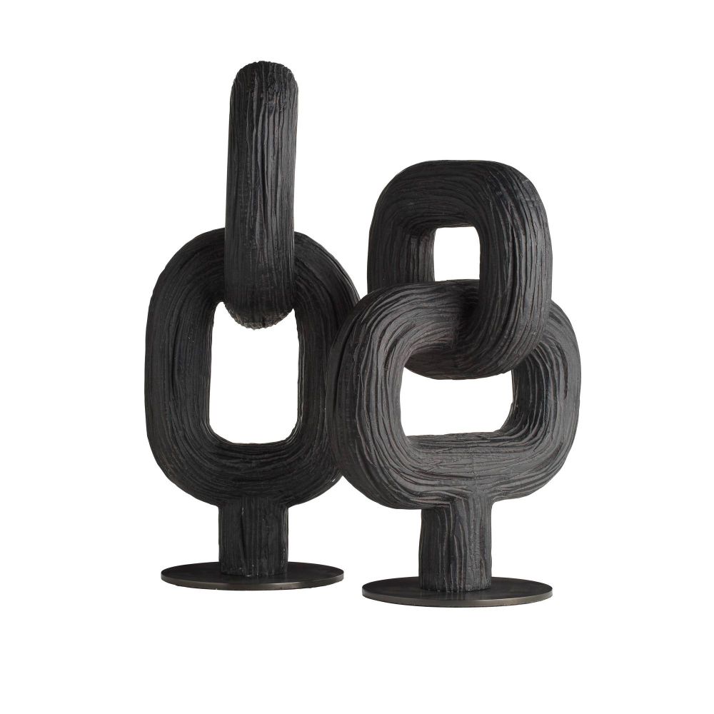 Black abstract sculpture on a white background