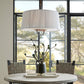 Dining room with a round table, chairs, and a large window.