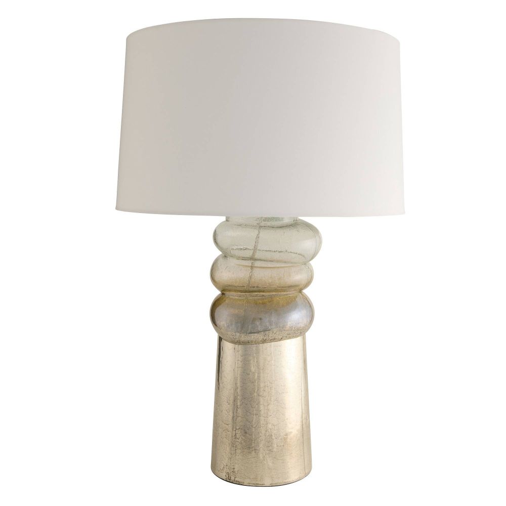 Table lamp with a textured base and white shade on a white background