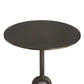 Round metal table with a textured base on a white background