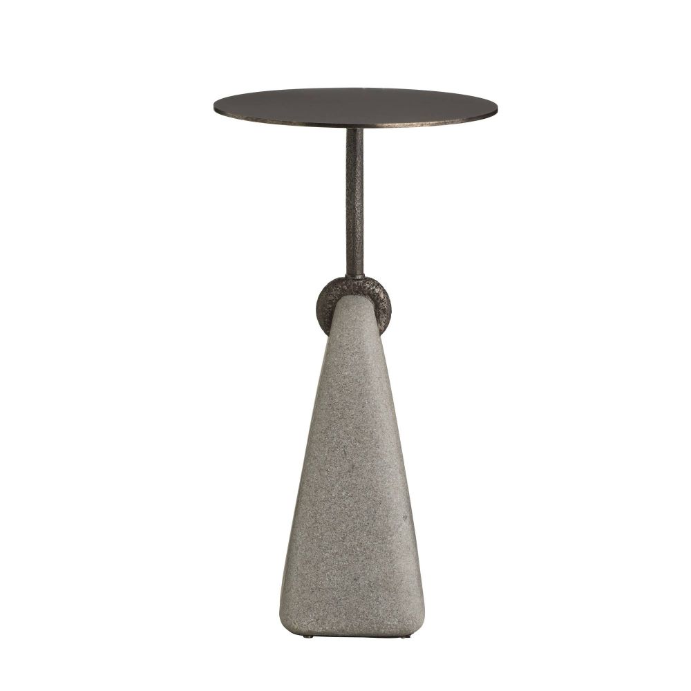 Small round table with a textured base on a white background