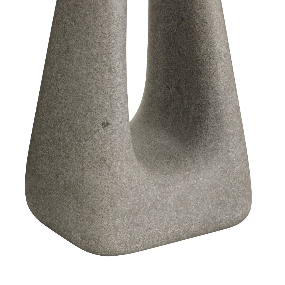 Close-up of a textured stone sculpture on a white background