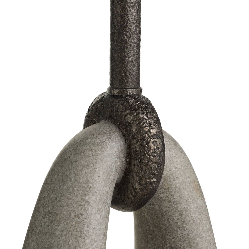 Close-up of a metal hook with a textured surface on a white background