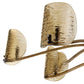 Decorative wall sconce with three amber glass shades on a white background