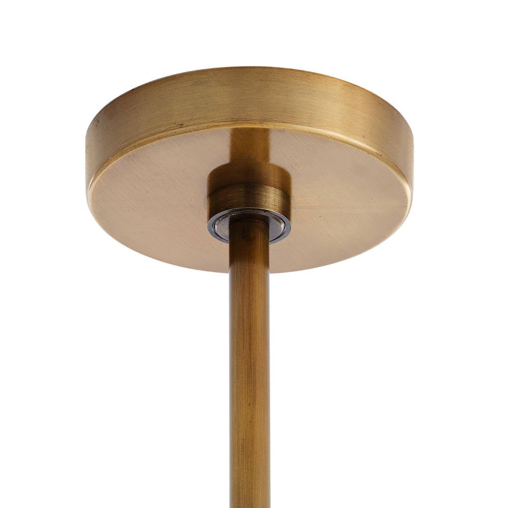 Close-up of a brass ceiling light fixture on a white background