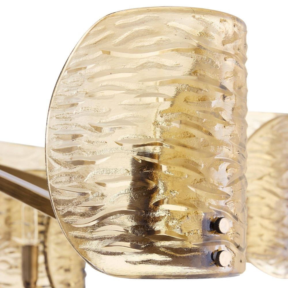 Close-up of a gold ring with textured design on a white background