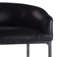 Close-up of a black leather chair with a textured metal frame on a white background
