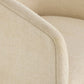Close-up of a beige upholstered chair with a soft texture.