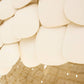 Close-up of a decorative wall piece with scalloped beige panels.