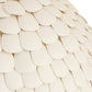 Close-up of a textured beige surface with circular patterns