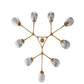 Modern chandelier with gold and clear glass shades on a white background