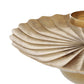 Gold shell-shaped candle holder on a white background