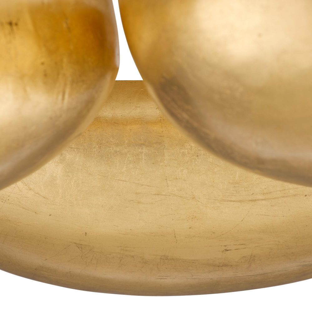 Close-up of a gold ring with a textured surface on a white background