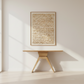 Wooden table with a textured wall art piece in a minimalistic room.