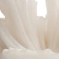 Close-up of light pink fabric with a soft focus background