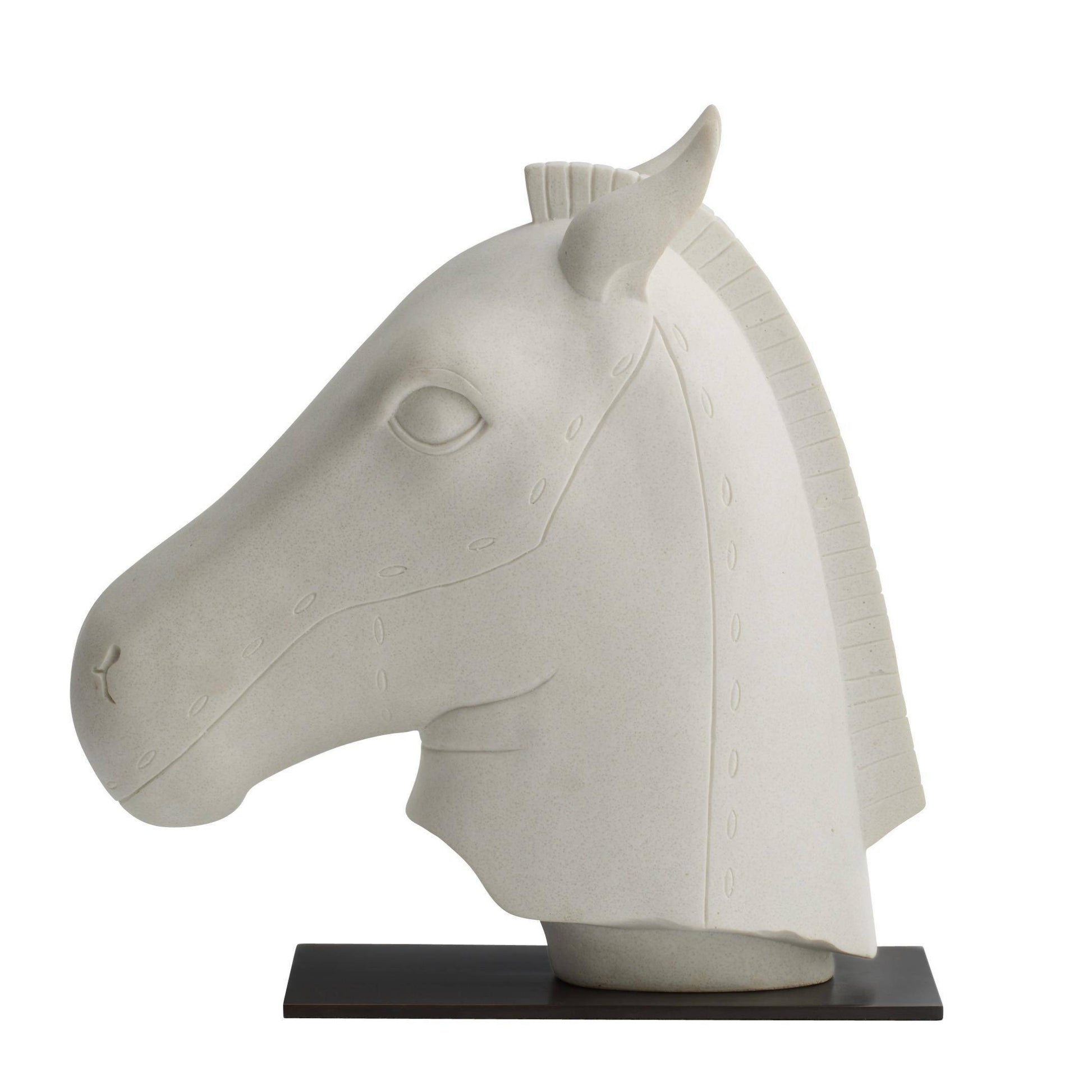 White horse head sculpture on a black base against a white background
