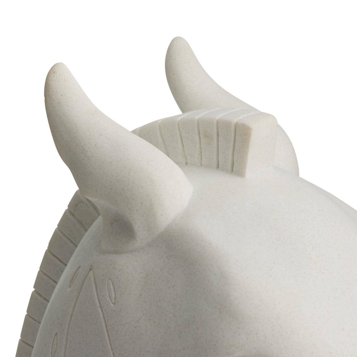 Close-up of a stone bull sculpture on a white background