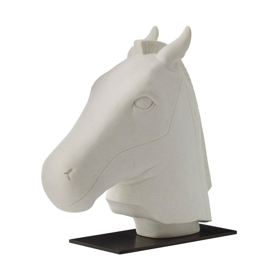 White horse head sculpture on a black stand against a white background
