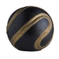 Black and gold massage ball on a white background