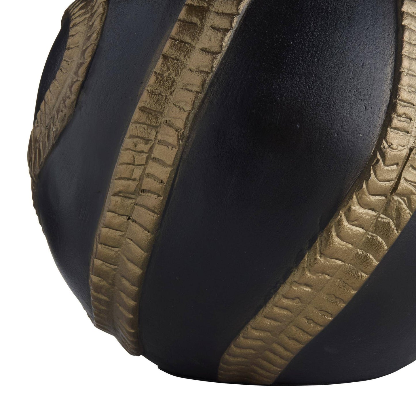 Close-up of a black and brown textured ball on a white background
