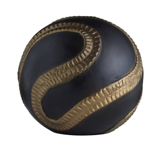 Black and gold ball with textured pattern on a white background
