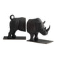 A pair of black rhinoceros bookends shaped like rhinos, standing on rectangular black bases against a plain white background.
