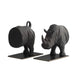 Two black rhinoceros bookends on a white background