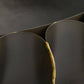 Close-up of a dark green plant with a yellow stem against a black background