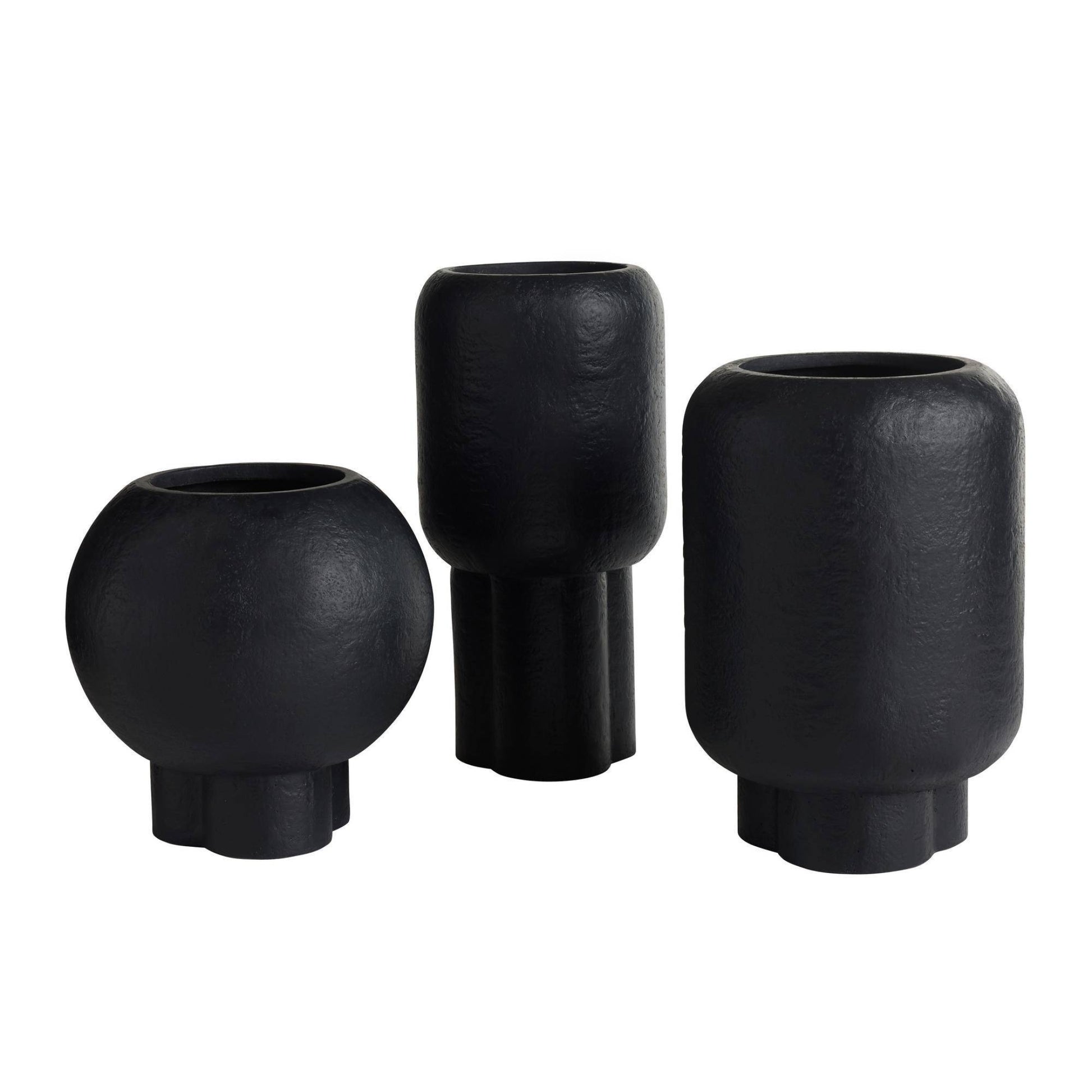 Set of three black ceramic vases on a white background