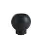 Black spherical vase on a white background