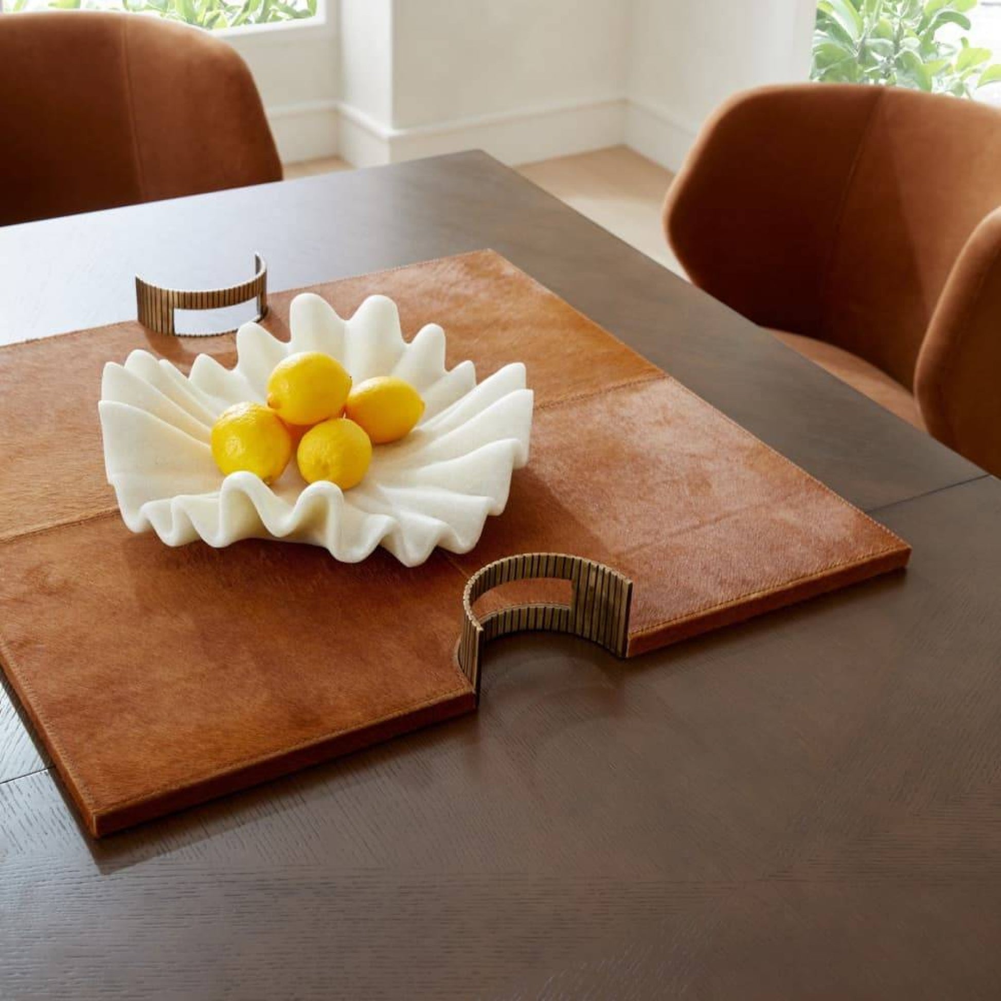 brown hair on hide tray with antique brass handles styled