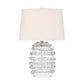 A table lamp with a clear glass base featuring a textured, bubble-like spiral pattern and a white fabric drum shade, shown against a plain white background.
