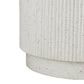 Close-up of a textured white vase on a white background